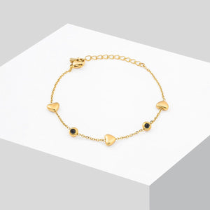 Gold-plated bracelet with heart and black/white cubic zirconia charm