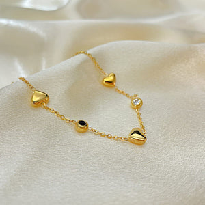 Gold-plated bracelet with heart and black/white cubic zirconia charm